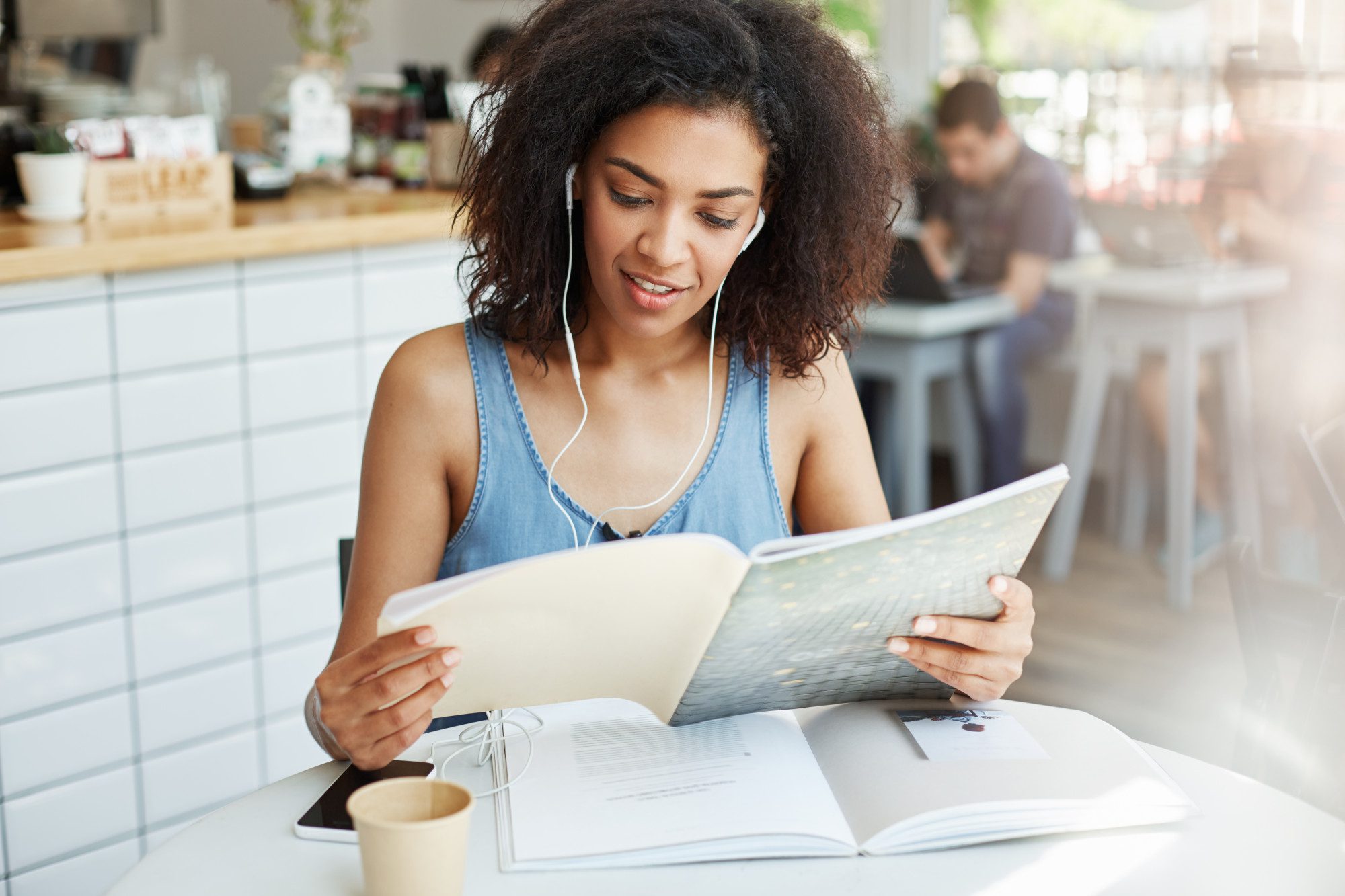 Young woman reading a newsletter | Most Holy Eucharist
